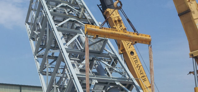 crane holding Process Equipment Modules outside