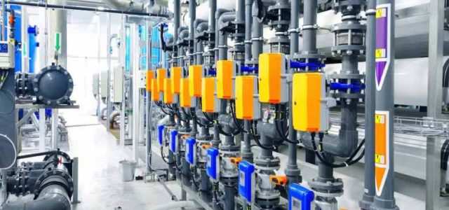 blue and orange pipes in a water filtration facility