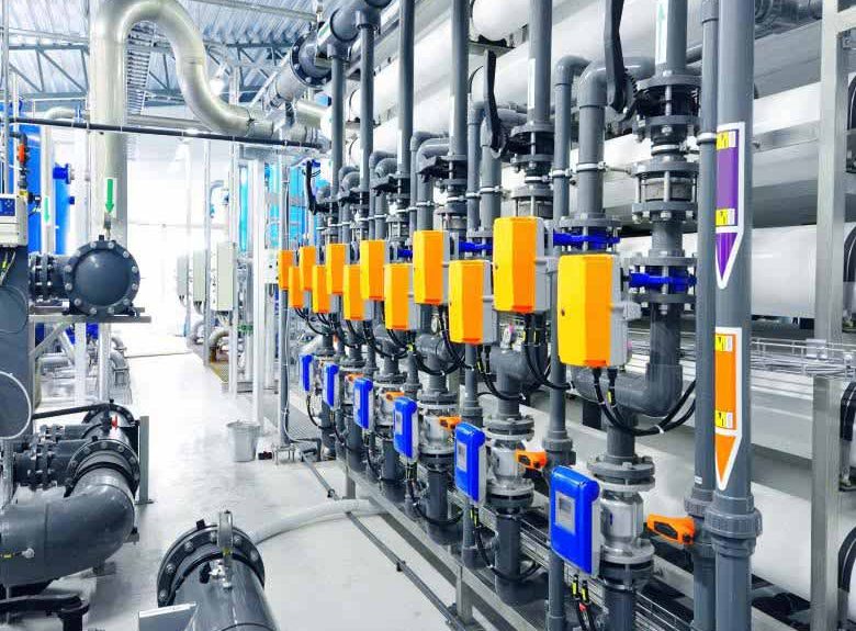 blue and orange pipes in a water filtration facility