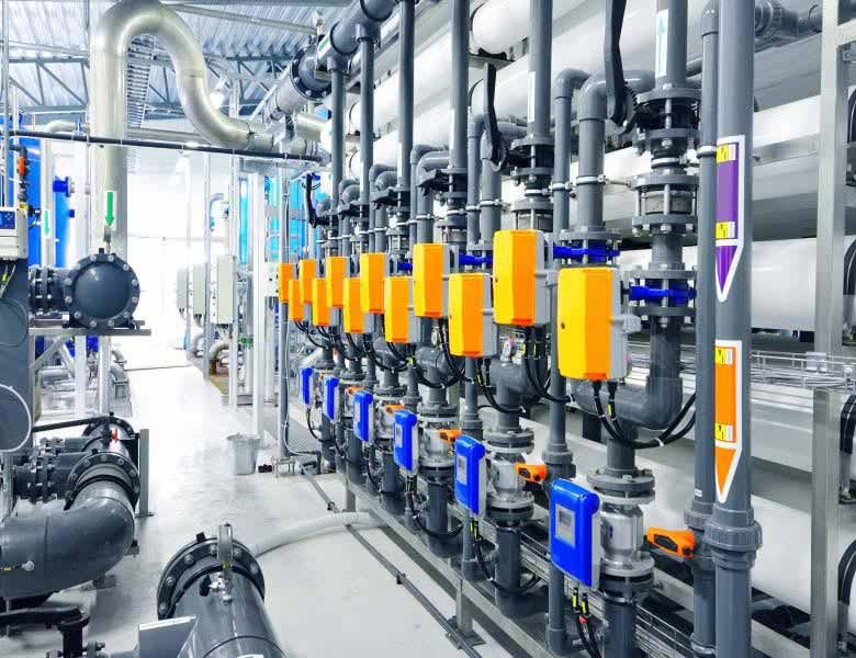 blue and orange pipes in a water filtration facility